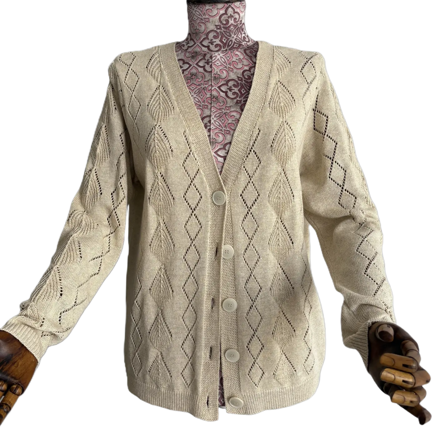 Openwork knit detail on a beige cardigan
