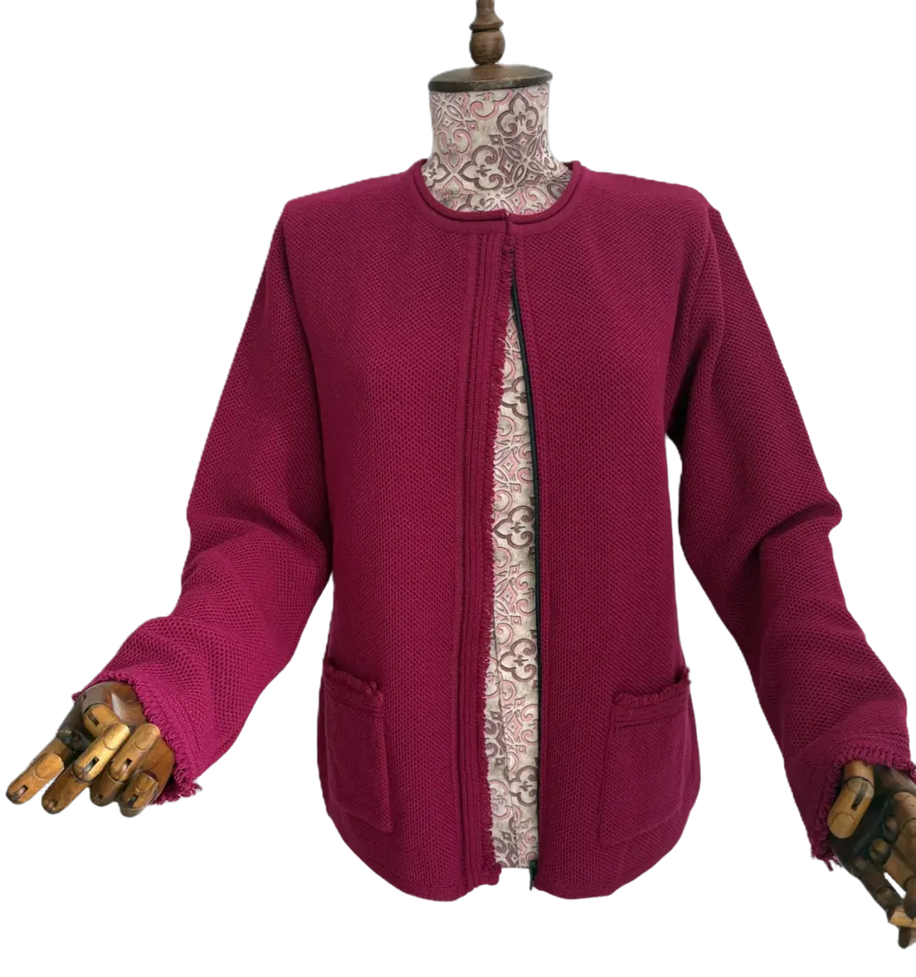 Close-up of a magenta zip knit cardigan