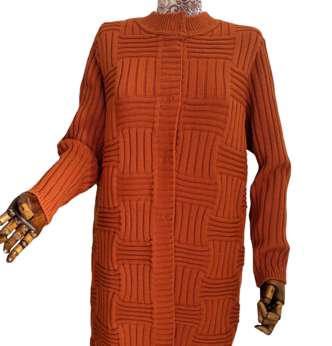 Textured knit detail on a rust coloured dress