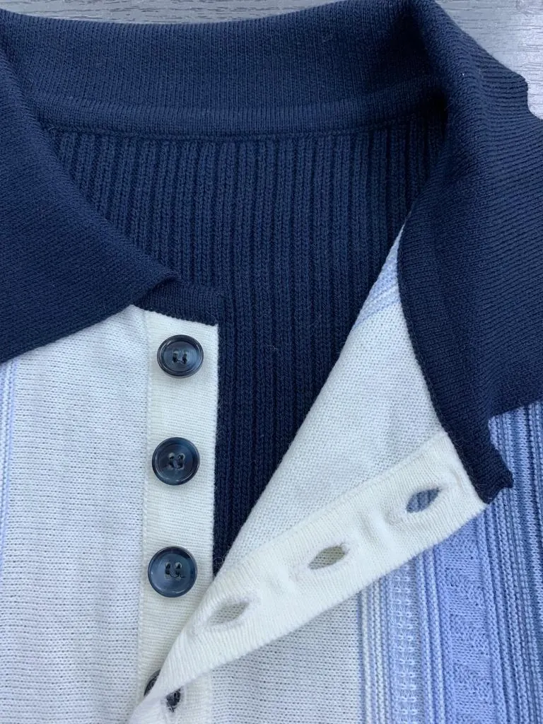 Close-up of a knitted polo collar and buttoned placket