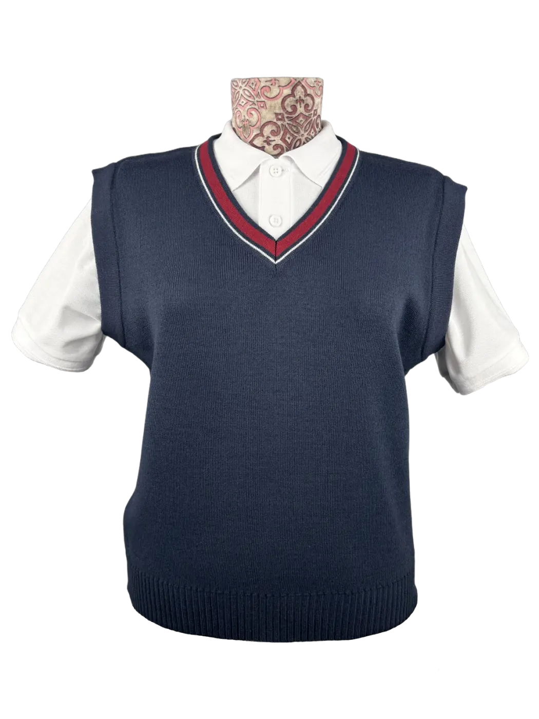 Navy knitted vest worn over a white polo shirt